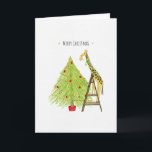 Christmas Tree and Giraffe on a Ladder Holiday Card<br><div class="desc">This is a fun little Christmas card design featuring an illustration of a giraffe putting the star on top of the Christmas tree,  but even the giraffe needs to use a ladder to reach the top of the tree.

Design and Illustration by Natalie Kinnear</div>