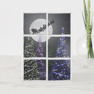 Christmas trees  and moon with Santa in window Card