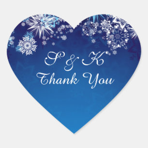 Christmas white snowflakes on blue heart shaped sticker