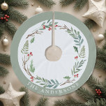Christmas Winter Berries Wreath Custom Family Name Brushed Polyester Tree Skirt<br><div class="desc">Custom-designed Christmas tree skirt featuring personalized family name encircled in an elegant watercolor Christmas wreath with winter greenery and red berries.</div>