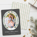 Christmas Winter Greenery Oval Photo Holiday Card<br><div class="desc">This festive Christmas holiday card showcases an oval photo framed with winter greenery and red berries on a dark slate grey background. Personalize this modern elegant holiday card by adding your photo and family name.</div>