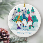 Christmas with my Gnomies Personalized Gnome Ceramic Ornament<br><div class="desc">Cute gnome Christmas ornament which you can personalize on the back with your name(s) and the year. The design has the fun saying "Christmas with my Gnomies" with a whimsical drawing of colorful gnomes in a forest of christmas trees.</div>