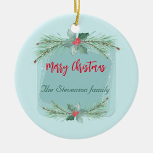 Christmas wreath with holly and spruce branches. ceramic ornament