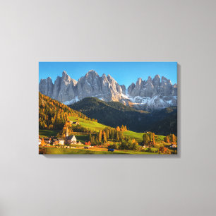 Church and village with mountains landscape canvas print