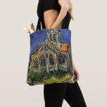 Church at Auvers-sur-Oise by Vincent van Gogh Tote Bag<br><div class="desc">Church at Auvers by Vincent van Gogh is a vintage fine art post impressionism architectural painting. An exterior view of a church with stained glass windows and a figure walking towards the Chapel along a cobblestone path. About the artist: Vincent Willem van Gogh (1853 -1890) was one of the most...</div>