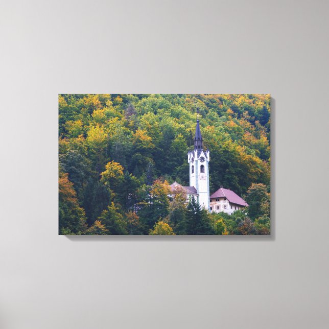 Church in a fall forest in Slovenia Canvas Print (Front)