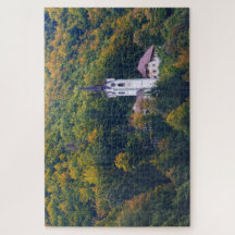 Church in a fall forest in Slovenia