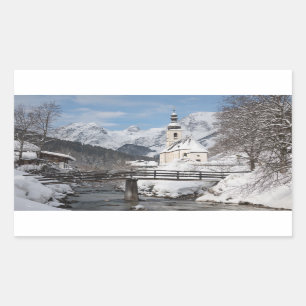 Church in the snow with Alps mountains in winter Sticker