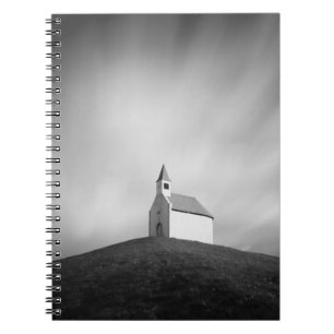 Church on a hill in black and white notebook