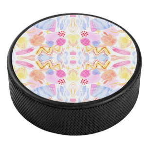 Circular object featuring a colourful abstract hockey puck