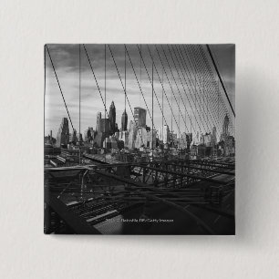 Cityscape through bridge cables 2 inch square button