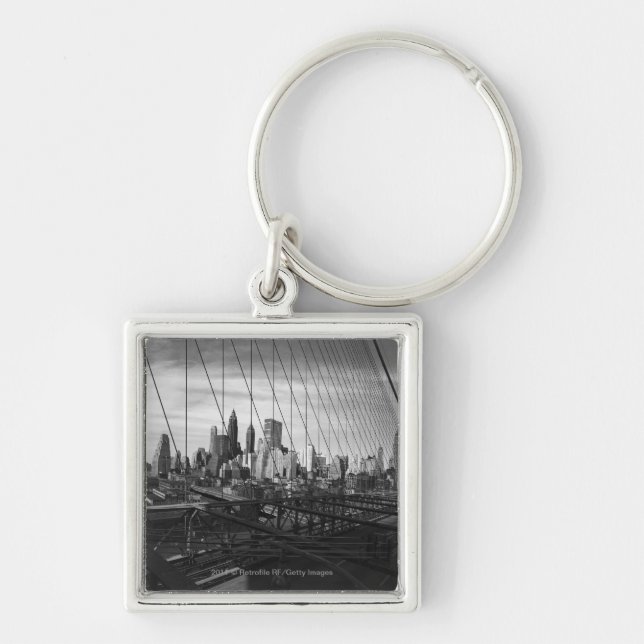 Cityscape through bridge cables keychain (Front)