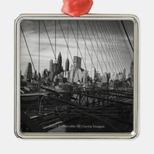 Cityscape through bridge cables metal ornament