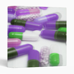 Classeur Capsules vertes pourpres roses de pilules