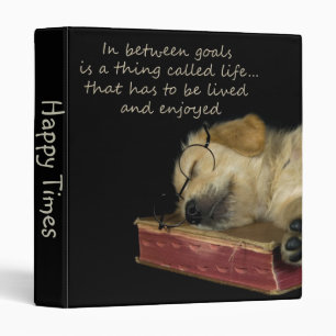 Classeur Chiot Golden Retriever dormant sur un livre