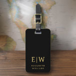 Classic Black Gold Minimalist Monogram Name Luggage Tag<br><div class="desc">Elevate your travel experience with our Classic Elegant Modern Minimalist Monogram Luggage Tag. This meticulously designed accessory seamlessly combines timeless elegance with contemporary minimalism, ensuring your luggage stands out with sophistication. Crafted with precision and attention to detail, this luggage tag is more than just a practical item; it's a personalized...</div>