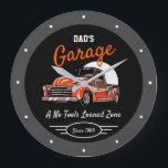 Classic Chevy Truck Garage Dad's Any Name Black Large Clock<br><div class="desc">Dad's or any name garage with 50's Chevy on a black background with orange script and a grey border. Just use the personalize this template option to change the text. Funny slogan typography with any date. Just choose the hand colour and size.</div>