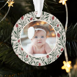 Classic Floral Frame Baby's First Christmas Ornament<br><div class="desc">This beautiful Baby's First Christmas holiday photo ornament features a hand drawn floral and greenery pattern in classic, traditional Christmas colours of deep green, burgundy red, and ivory over a custom colour background (shown in light sand beige). A small ivory coloured frame allows your photo to stand out against the...</div>