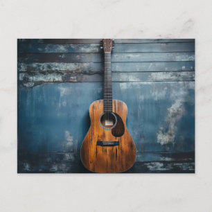 Classic guitar on blue rustic wood wall postcard