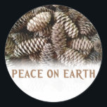 Classic Holiday Pine Cone Peace On Earth Classic Round Sticker<br><div class="desc">Festive, earthy pine cones set off this classic, elegant design wishing Peace On Earth.</div>