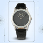 Classic Laurel Wreath Black Gold Monogram Watch<br><div class="desc">A classic laurel wreath design in black and gold,  giving a perfect mix of charm and elegance.
The monogram adds a special touch.
Ideal as a personalized gift for family and friends</div>