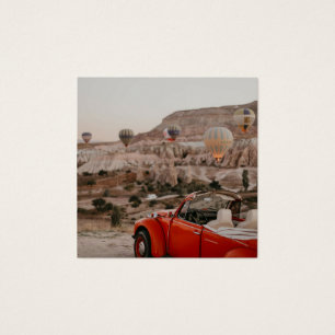 Classic Vintage Red Car Watching Hot Air Balloons