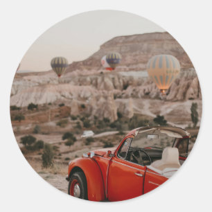 Classic Vintage Red Car Watching Hot Air Balloons Round Sticker