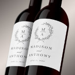 Classic White Simple Elegant Monogram Wedding Wine Label<br><div class="desc">This tasteful and classic custom wine label design conveys an elegant look for your wedding or engagement celebration. A simple open laurel wreath of sketched leaves surrounds the monogram initial of the bride and groom. The elegant yet simple text template is ready to personalize with the bride and groom's names...</div>