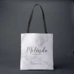 Classy Elegant Marble Personalized Bridesmaids Tote Bag<br><div class="desc">Classy Elegant Marble Modern Script Personalized Bridesmaids Tote Bag
featuring personalized bridesmaid's name in modern calligraphy font style with title and wedding date in modern sans serif font style on white marble background.

Also perfect for Maid of Honour,  Flower Girl,  Mother of the Bride and more.</div>