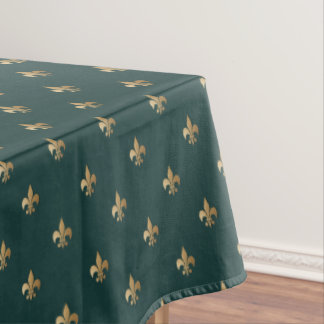 Classy golden like fleur de lis on dark sea green tablecloth
