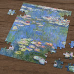 Claude Monet // Water Lilies Jigsaw Puzzle<br><div class="desc">Water Lilies is a series of approxiamately 250 oil paintings by French Impressionist Claude Monet (1840-1926). The paintings depict Monet's flower garden at Giverny and were the main focus of Monet's artistic production during the last thirty years of his life.</div>