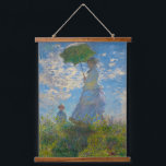 Claude Monet Woman with a Parasol Hanging Tapestry<br><div class="desc">Turn any wall into a window of Impressionist beauty. This tapestry showcases Claude Monet’s Woman with a Parasol, glowing with soft whites, airy blues, and fresh greens. The graceful mother-and-child scene, painted with Monet’s light-filled brushstrokes, captures the serenity of a breezy summer day. Lightweight and versatile, the tapestry is perfect...</div>