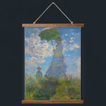 Claude Monet Woman with a Parasol Hanging Tapestry<br><div class="desc">Turn any wall into a window of Impressionist beauty. This tapestry showcases Claude Monet’s Woman with a Parasol, glowing with soft whites, airy blues, and fresh greens. The graceful mother-and-child scene, painted with Monet’s light-filled brushstrokes, captures the serenity of a breezy summer day. Lightweight and versatile, the tapestry is perfect...</div>
