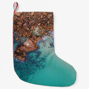 Clear blue sea and rocks small christmas stocking