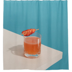 Clear drinking glass with brown liquid