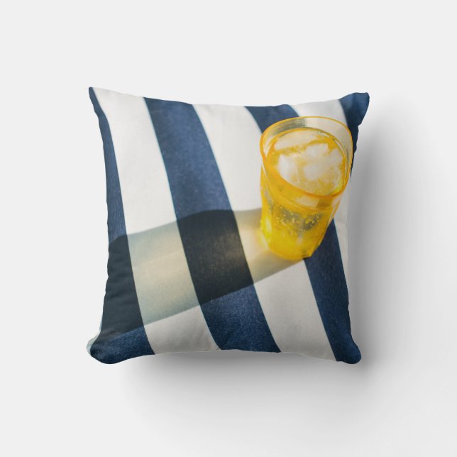 Clear drinking glass with yellow liquid throw pillow (Front)