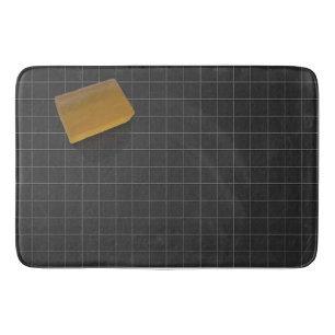 Clear Orange Soap on a Black Tile Floor Bath Mat