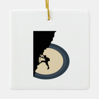 Climbing mountain man at night silhouette ceramic ornament