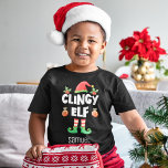 Clingy elf matching christmas family group name toddler t-shirt<br><div class="desc">Get into the holiday spirit with this fun Clingy elf t-shirt which is part of a matching family elf outfit collection containing gifts for any family member. Perfect for any Christmas family reunion, or as a family matching pajama, this t-shirt features a cute elf hat and legs, with the caption...</div>