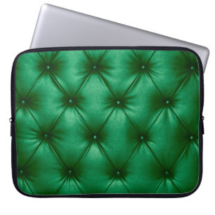 Close up background texture of dark green capitone laptop sleeve