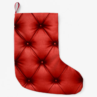 Close up background texture of scarlet red capiton small christmas stocking