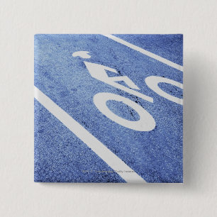 Close-up of a bicycle sign on the road 2 inch square button