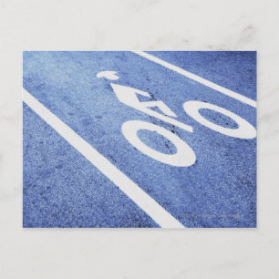 Close-up of a bicycle sign on the road postcard