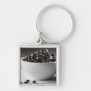 Close-up of a bowl full of coffee beans keychain