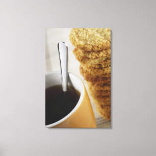 Close-up of a cup of coffee with cookies canvas print