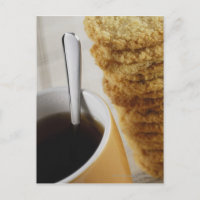 Close-up of a cup of coffee with cookies