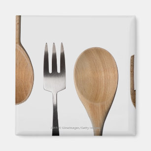 Close-up of a fork with a wooden spoon magnet