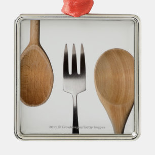 Close-up of a fork with a wooden spoon metal ornament