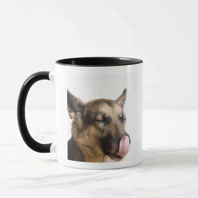 Close-up of a German Shepherd licking its nose Mug (Left)