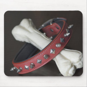 Close-up of a pet collar and a dog bone mouse pad